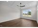 Bedroom boasts coffered ceilings, natural light, and hardwood floors at 5124 Grist Stone Way, Youngsville, NC 27596