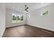 Bright bedroom with large windows and neutral walls and ceiling fan at 5124 Grist Stone Way, Youngsville, NC 27596