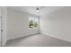 Bright bedroom with neutral carpet and trim and a ceiling fan at 5124 Grist Stone Way, Youngsville, NC 27596