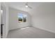 Bedroom boasts neutral paint, carpet, and natural light at 5124 Grist Stone Way, Youngsville, NC 27596