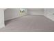 Bonus room with dormer, neutral carpet and white trim at 5124 Grist Stone Way, Youngsville, NC 27596