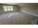 Light-filled bonus room with a large window offering outdoor views and neutral walls at 5124 Grist Stone Way, Youngsville, NC 27596