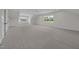 Large bonus room with neutral carpet and trim and lots of windows at 5124 Grist Stone Way, Youngsville, NC 27596
