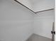 Walk-in closet with a clothing rod and carpet at 5124 Grist Stone Way, Youngsville, NC 27596
