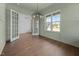Dining room with wainscoting, hardwood floors and lots of natural light at 5124 Grist Stone Way, Youngsville, NC 27596