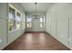 Dining room with wainscoting, hardwood floors and lots of natural light at 5124 Grist Stone Way, Youngsville, NC 27596