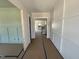 Hallway leading to other rooms, featuring paneled walls and carpet protection at 5124 Grist Stone Way, Youngsville, NC 27596