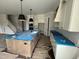 Spacious kitchen features a large island, pendant lighting and shaker style cabinets at 5124 Grist Stone Way, Youngsville, NC 27596