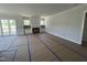 Bright living room with a sliding door leading to the porch, built-in cabinets, and a fireplace at 5124 Grist Stone Way, Youngsville, NC 27596