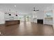 Open-concept living area features hardwood floors, fireplace, and abundant natural light at 5124 Grist Stone Way, Youngsville, NC 27596