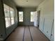 Bright living room with wainscoting, featuring multiple windows for natural light at 5124 Grist Stone Way, Youngsville, NC 27596