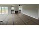 Bright living room featuring a fireplace, built-in shelving, and sliding glass doors to the outside deck at 5124 Grist Stone Way, Youngsville, NC 27596