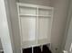 Mudroom with a built-in shelving unit, bench seating, and storage compartments at 5124 Grist Stone Way, Youngsville, NC 27596