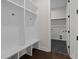Well-lit mudroom with built-in bench and storage cubbies, plus tile flooring and entry to the laundry area at 5124 Grist Stone Way, Youngsville, NC 27596