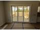 View of covered porch through sliding glass door highlighting a relaxing outdoor space at 5124 Grist Stone Way, Youngsville, NC 27596