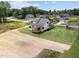 Aerial view of the rear of a new home, showcasing the lawn and surrounding neighborhood at 5124 Grist Stone Way, Youngsville, NC 27596
