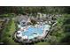 Stunning aerial view of community pool with lounge areas and mature trees at 1024 Dillon Lake Dr, Knightdale, NC 27545