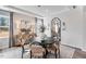 Bright dining room with modern lighting, stylish furnishings, and view to the exterior at 1024 Dillon Lake Dr, Knightdale, NC 27545