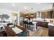 Open concept kitchen with stainless steel appliances, large island, and breakfast bar seating at 1024 Dillon Lake Dr, Knightdale, NC 27545