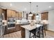 Modern kitchen featuring stainless appliances, an island with seating, and ample storage at 1024 Dillon Lake Dr, Knightdale, NC 27545
