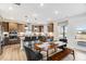 Open kitchen with stainless steel appliances, center island, and adjacent dining area at 1024 Dillon Lake Dr, Knightdale, NC 27545