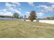 Expansive fenced backyard with trees, lush lawn, and lots of sunlight at 1024 Jarrett Bay Rd, Willow Springs, NC 27592