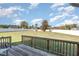 Large backyard, fenced in, with a wooden deck and seating area at 1024 Jarrett Bay Rd, Willow Springs, NC 27592