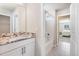 Bright bathroom features a granite countertop and a shower over tub combo at 1024 Jarrett Bay Rd, Willow Springs, NC 27592