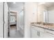 Bathroom featuring granite countertops, white cabinets, and a view into an adjacent bedroom at 1024 Jarrett Bay Rd, Willow Springs, NC 27592