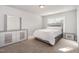 Well-lit bedroom with neutral tones, matching furniture, and ample natural light from the window at 1024 Jarrett Bay Rd, Willow Springs, NC 27592
