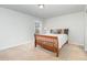 Cozy bedroom showcasing a neutral palette and soft, natural light at 1024 Jarrett Bay Rd, Willow Springs, NC 27592