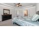 Cozy bedroom with neutral carpet, a dresser, and glimpses into the en-suite bathroom at 1024 Jarrett Bay Rd, Willow Springs, NC 27592