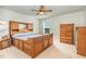 Spacious bedroom with light carpet, ceiling fan, and wooden furniture set at 1024 Jarrett Bay Rd, Willow Springs, NC 27592