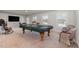Large bonus room featuring a pool table, media center, and neutral carpet at 1024 Jarrett Bay Rd, Willow Springs, NC 27592