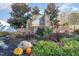 Attractive stone community entrance sign with waterfall feature and landscaped surroundings, pumpkins included at 1024 Jarrett Bay Rd, Willow Springs, NC 27592