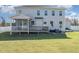 Two story home has a screened in porch, deck, and grassy lawn at 1024 Jarrett Bay Rd, Willow Springs, NC 27592