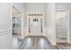 Inviting foyer with wood-look flooring, a decorative front door and access to the living areas at 1024 Jarrett Bay Rd, Willow Springs, NC 27592