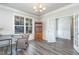 Home office with wood-look flooring, a large window and crown molding at 1024 Jarrett Bay Rd, Willow Springs, NC 27592