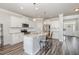Beautiful kitchen with white cabinets, stainless steel appliances, granite counters and bar stool seating at 1024 Jarrett Bay Rd, Willow Springs, NC 27592