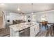Modern kitchen island featuring granite countertops, stainless steel dishwasher, and pendant lighting at 1024 Jarrett Bay Rd, Willow Springs, NC 27592
