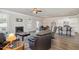 Inviting living room featuring a fireplace, wood-look floors, dining area and kitchen at 1024 Jarrett Bay Rd, Willow Springs, NC 27592