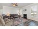 Cozy living room featuring a fireplace, wood-look floors, and comfortable seating at 1024 Jarrett Bay Rd, Willow Springs, NC 27592