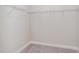 Empty walk-in closet with neutral carpet and wire shelving, ready for storage solutions at 1024 Jarrett Bay Rd, Willow Springs, NC 27592