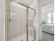 Stylish bathroom showcasing a glass shower and a view of a bedroom with plush carpeting at 1425 Patchings Ln, Knightdale, NC 27545