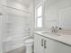 Modern bathroom with a shower-tub combination, white vanity, and clean, minimalist design at 1425 Patchings Ln, Knightdale, NC 27545