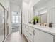 Luxurious bathroom featuring a double vanity with quartz countertop and a glass-enclosed shower at 1425 Patchings Ln, Knightdale, NC 27545