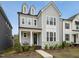 Charming two-story home featuring dormer windows, a welcoming front porch, and landscaped front yard at 1425 Patchings Ln, Knightdale, NC 27545