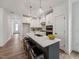 Bright and airy kitchen with white cabinetry, a quartz countertop island, and sleek stainless steel appliances at 1425 Patchings Ln, Knightdale, NC 27545