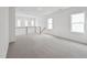 Bright and spacious loft area with large windows, perfect for a home office or recreation space at 1425 Patchings Ln, Knightdale, NC 27545