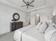 Comfortable main bedroom showcasing neutral tones, a ceiling fan, and stylish decor at 1425 Patchings Ln, Knightdale, NC 27545